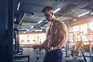 muscular bodybuilder man in the gym